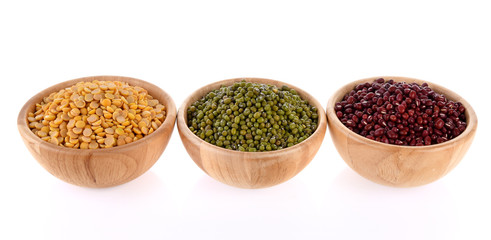 green beans, soy beans, red beans, wooden bowls on white background