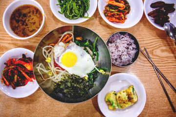 Traditional Korean dinner, a set of several dishes, with rice and kimchi. Shot from above