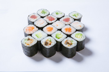 A plate with different kinds of sushi and rolls