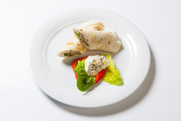 Rolls from pita bread stuffed with meat salad and cheese
