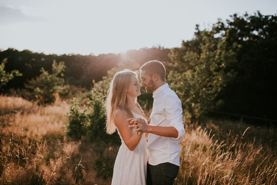 Young couple  standing in meadow 