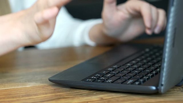 Girl having problems with laptop and pressing button couple of times
