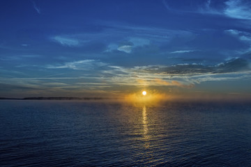 Misty sunrise, sunset on a body of water