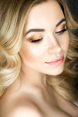Obraz premium Beautiful woman portrait in nude colors with clear skin and blond hair.