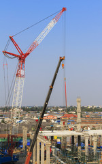 Fototapeta premium Construction site with many construction cranes.