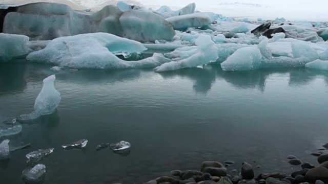 Timelapse blue icebergs floating and moving in Jokulsarlon glacial lagoon. Natural landmark of Iceland