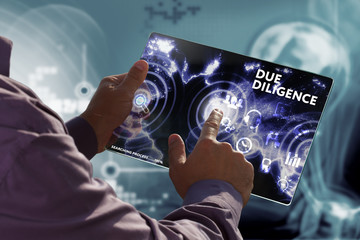 Business, Technology, Internet and network concept. Young businessman working on a virtual screen of the future and sees the inscription: Due diligence