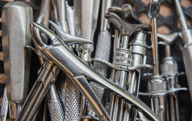 Closeup of dental pliers and other dentist's tools.