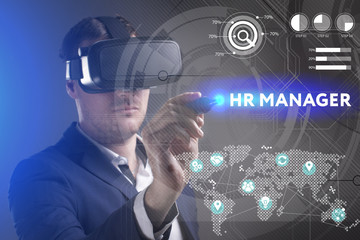 Business, Technology, Internet and network concept. Young businessman working in virtual reality glasses sees the inscription: HR manager