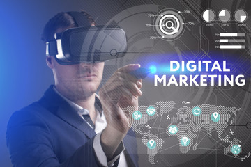 Business, Technology, Internet and network concept. Young businessman working in virtual reality glasses sees the inscription: Digital Marketing