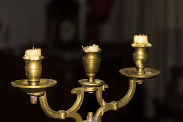 Fototapeta na wymiar Candlestick with three candles