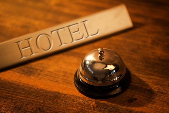 Vintage Service Bell At Old Hotel Reception Desk