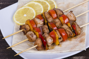 Tasty grilled meat and vegetables on skewer