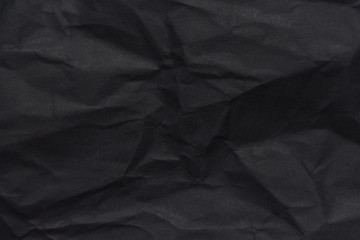 Fototapeta premium The background paper, crumpled black