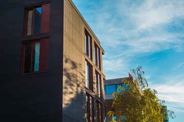 very dark office complex in square format