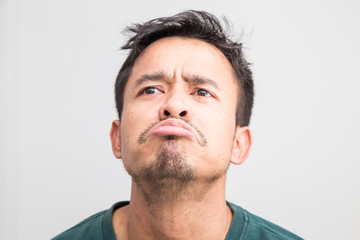 Crazy frown asian man on white background, Upset feeling