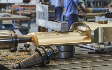 Milling head cutting on bronze material, Milling metalworking process. Industrial CNC metal...