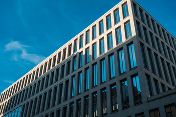 big finance building with darken shadows and blue sky