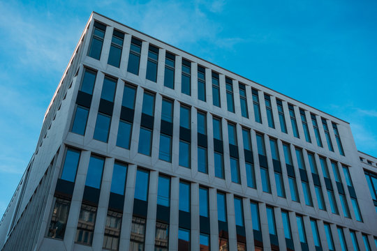darken colored modern office building with small windows