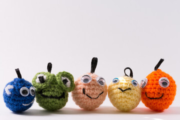 Crocheted woven colored toy balls with smile