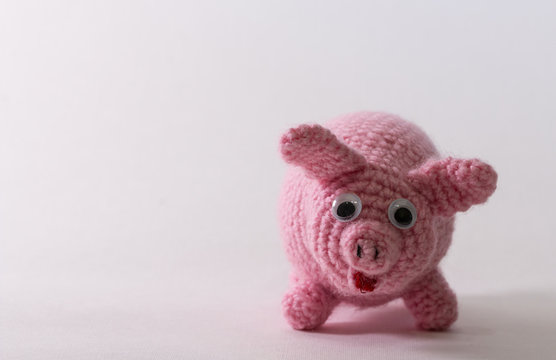 Crocheted woven with pink wool toy pig