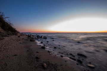 Amazing sunrise on the pier at the seaside. Gdynia Orlowo, Poland