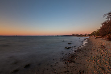 Amazing sunrise on the pier at the seaside. Gdynia Orlowo, Poland
