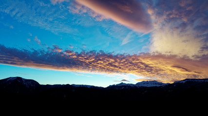 Lenticular (lens-shaped) clouds after sunset. Caucasus. Russia. The Caucasian reserve. Plateau of Lagonaki