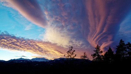 Lenticular (lens-shaped) clouds after sunset. Caucasus. Russia. The Caucasian reserve. Plateau of Lagonaki