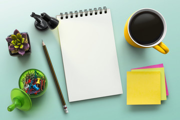 Notebook on office table with a cup of coffee, plant, stationery and office supplies. Blank notepad...
