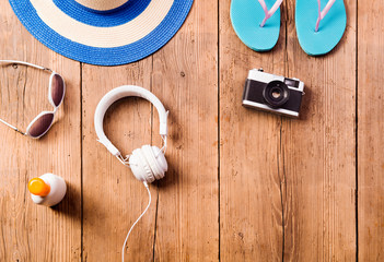 Summer vacation composition. Sunglasses, camera, hat, flip flops