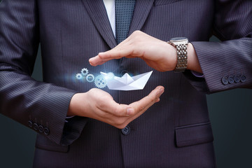 The boat as a symbol of a new business in the hands.