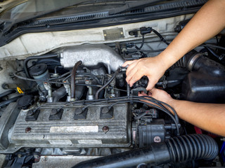 Car mechanic working in auto repair service