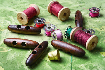sewing supplies on green background