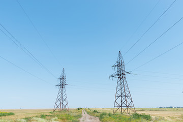 two electrical tower and blue sky