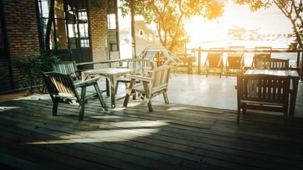 leisure corner with wood chairs and table Dining for four people . 4 chairs on a terrace on a summer day