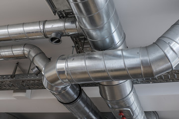 Ventilation pipe system in kitchen interior.