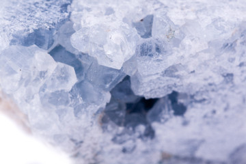 macro mineral celestite stone on a white background