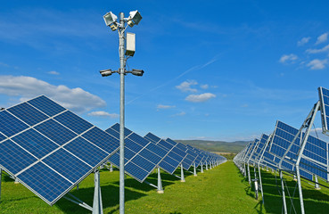 Green energy - photovoltaic power plant on green meadow