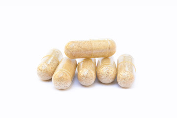 Natural medicine capsules isolated on a white background