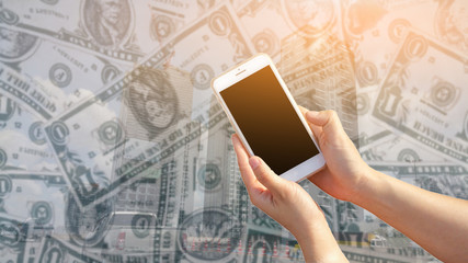 hand holding Modern mobile smart phone with black screen On a money Background . Meaningful Doing...