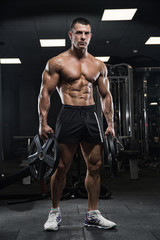 Brutal strong athletic men pumping up muscles workout bodybuilding concept background - muscular...