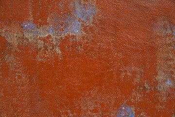 Cracking and peeling paint on a wall