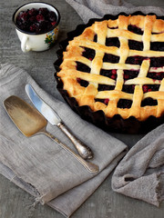 Traditional berries yeast pie tart on rustic wooden background. Homemade sweet cake. Baked pastry food. Top view. Space for text.