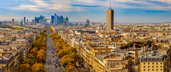 Paris, France - Champs Elysees cityscape. Panorama from the Arc de Triomphe. Blue sky with clouds...