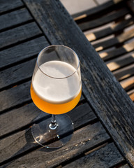 Bellini Cocktail made with peach in wine glass at garden