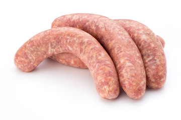 Raw sausage with parsley leaf isolated on white background.