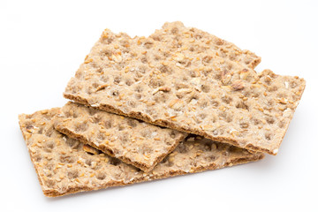 Stack of wholegrain crispy bread with sunflower, chia and sesames seeds