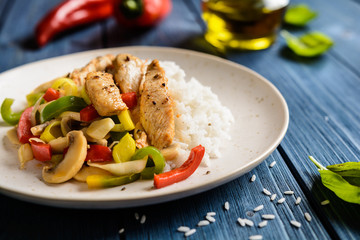 Fried chicken breasts pieces served with steamed vegetable and rice