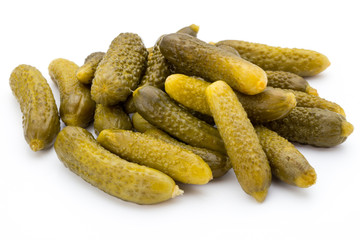 Marinated pickled cucumbers isolated on the white.